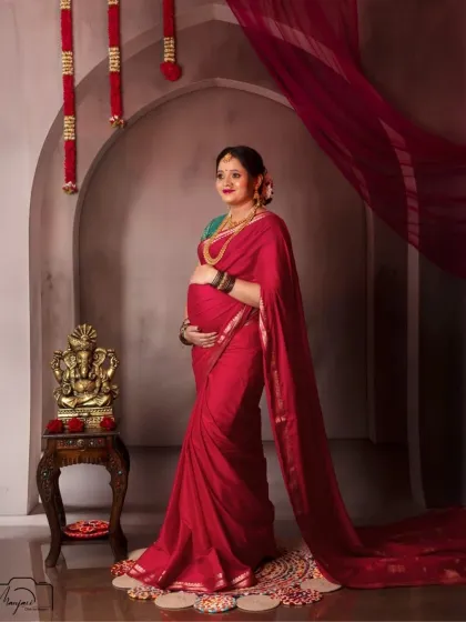 There is a timeless elegance in tradition. For mamas who wish to honor their heritage, I offer classic saree portraits with setups that reflect cultural beauty, like this vintage arch, creating a portrait that feels both regal and deeply personal.