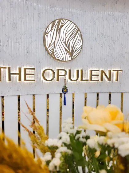 A close-up of our branding and the beautiful floral arrangements from a recent event with Kevin Murphy. We take pride in the small details that make our salon special.