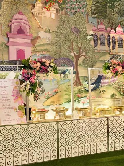Another view of our artistically themed buffet setup. The hand-painted backdrops and coordinated floral decor transform the dining area into a visual masterpiece.