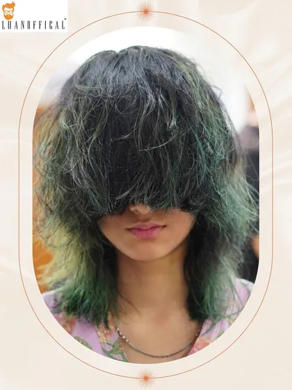 The texture and color of this edgy short haircut create a bold fashion statement that is both unique and stylish.
