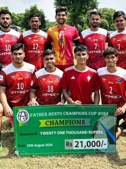 The team posing with the winners' cheque after being crowned champions of the Father Bento Champions Cup.