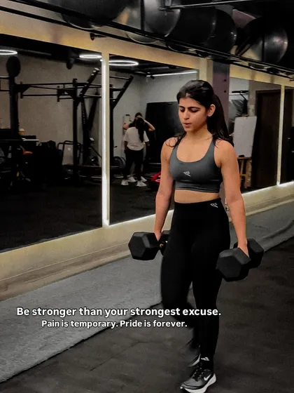 This is the focus and determination we build every day. We guide you to be stronger than your excuses, using tools like dumbbells for farmer's walks to build grip strength and full body stability.