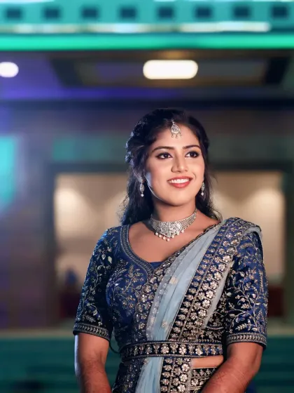 For Sneha's reception, we went for a soft glam look to match her elegant blue lehenga. The focus was on luminous skin and a subtle smokey eye, creating a polished and modern bridal style that lasted all night.