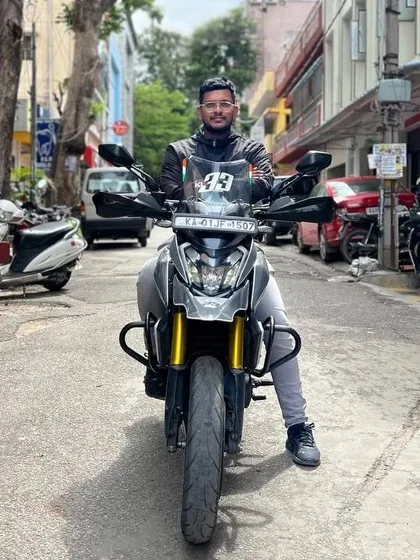 A rider on his custom Nardo Grey Dominar, celebrating World Motorcycle Day in the city streets of Bengaluru.