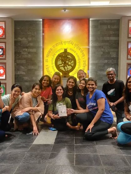 A candid moment of celebration and connection after a successful teacher training program.