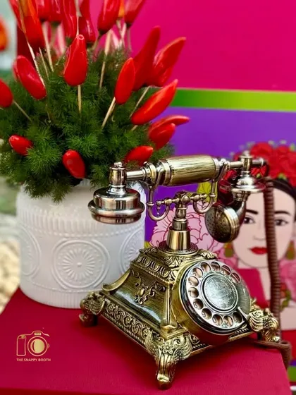It's all in the details. This close-up highlights the beautiful vintage design of my Classic Gold phone, complemented by quirky, themed decor. It’s a stylish addition that elevates your event's aesthetic.