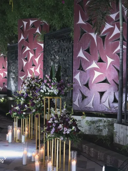 The walkway to the reception stage, lined with candles and floral arrangements. I design every part of the guest journey to be beautiful and experiential.