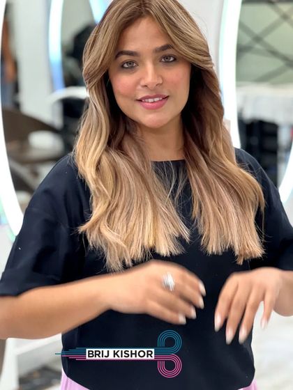 A creamy peach ash blonde teasing balayage that shines bright like an amethyst.