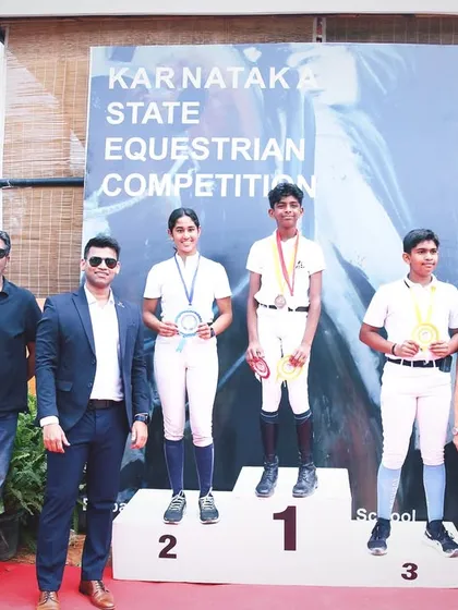 Another angle of the winners' podium at the Karnataka State Equestrian Competition, celebrating the hard-earned victories of my students.