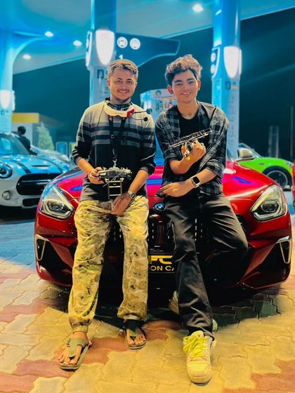 Holding my controller and FPV goggles, ready for the next shot. These tools are an extension of me when I'm flying.