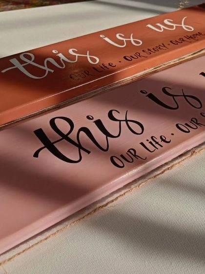Our hand-painted photo clippers are a heartfelt addition to your home. This "this is us" design, in a warm cinnamon and rose palette, is perfect for clipping on memories and loving messages.