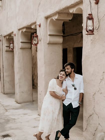 A quiet, romantic pose in a heritage-style alleyway, with soft lighting creating a warm atmosphere.