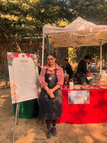 Me at our stall at a Christmas market. It's always a pleasure to participate in these events, connect with people, and share our food directly with the community.