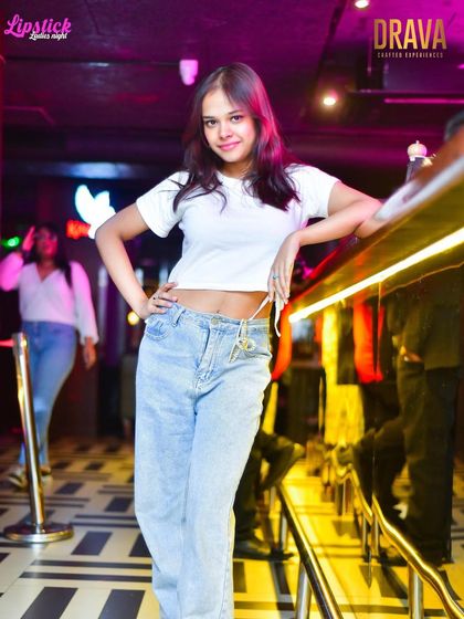 A guest striking a pose at the bar at Drava. It's a stylish venue with a fun-loving crowd.