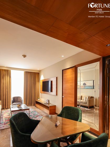 This view shows the layout of our deluxe suite, with a small dining table and a glimpse into the separate living area, offering plenty of room to spread out.