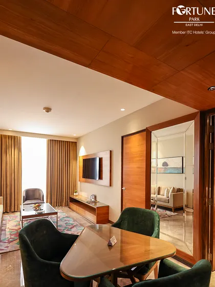 This view shows the layout of our deluxe suite, with a small dining table and a glimpse into the separate living area, offering plenty of room to spread out.