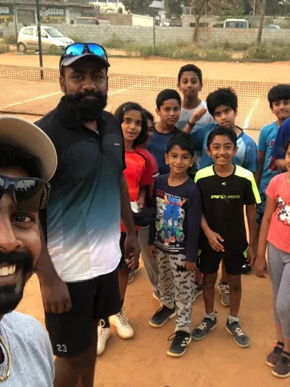 A quick selfie with my tennis kiddos after a great session. We are more than just a team, we are a tennis family. Building a fun, supportive community is just as important as the training itself.