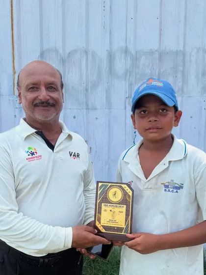 Vansh Rawat looking proud as he receives his Man of the Match plaque. It's these moments that build a young player's confidence.