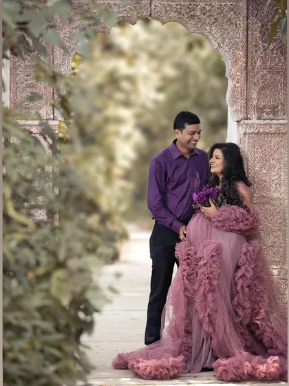 We captured this moment of pure joy at Sunder Nursery, using the soft natural light and beautiful architecture. An outdoor maternity photoshoot in Delhi allows for such romantic, dreamy images, especially with one of the flowing gowns from my client closet.