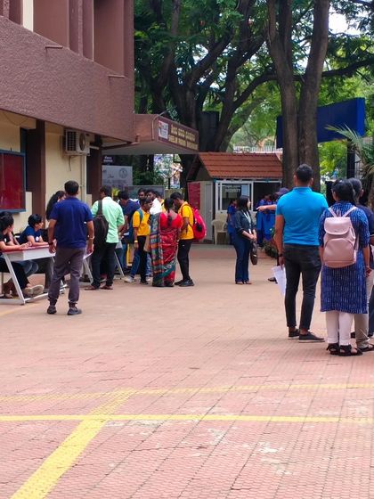 Our volunteers managing the registration desk and guiding candidates at the job fair. It's a crucial role that ensures the event runs smoothly for everyone.
