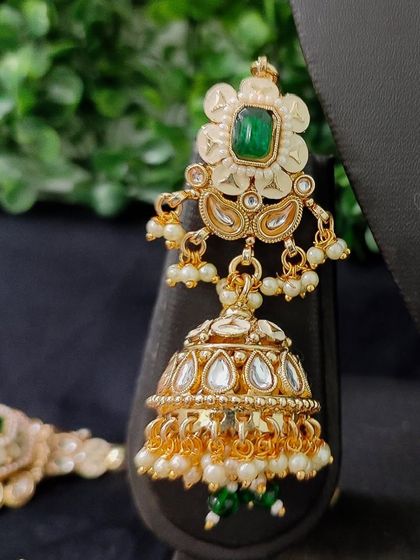 The matching earring, a perfect complement to the necklace.