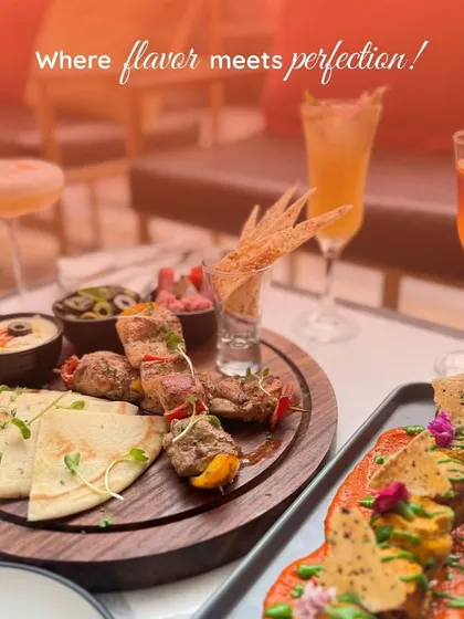 Where flavour meets perfection. A spread of our Lebanese platter and other beautifully plated appetizers, ready to be enjoyed with refreshing drinks.