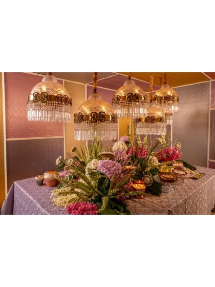 A wider view of our 'Rituals' collaboration, where my candles add a warm, fragrant glow to a magnificent tablescape filled with traditional florals and crowned by stunning crystal chandeliers.