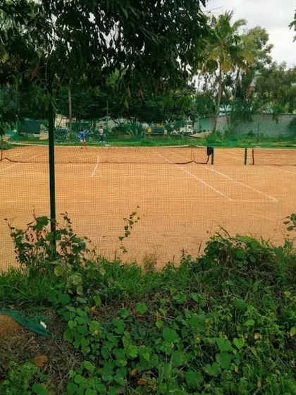 A clear view of one of our classic red clay courts. We maintain our facilities to ensure a professional and enjoyable playing experience for everyone.