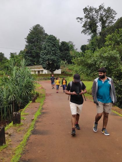 A casual walk on a forest road during our Kodachadri trek, with our certified guides leading the way.