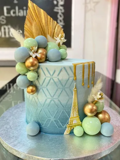Another angle of the detailed Paris-themed cake.