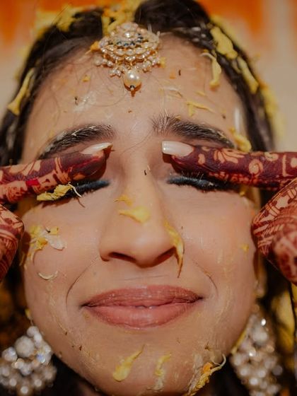 A funny, real moment where the bride tries to wipe haldi from her eyes. It's these unscripted bits that I love.