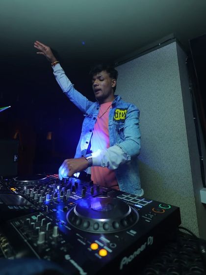 Hand in the air, feeling the beat. I love to get as into the music as the crowd does.