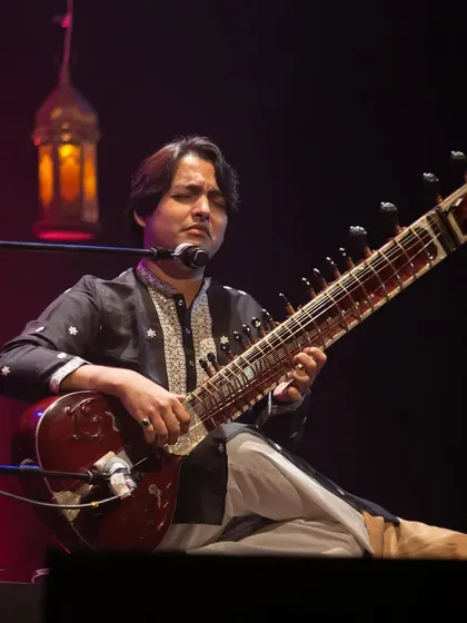 A close-up shot from the SHABD festival, with a traditional lantern glowing in the background. The ambiance was perfect for a night of soulful music and shayari.