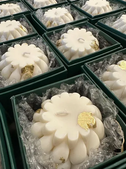 The braided candles carefully placed in their gift boxes, ready for dispatch.