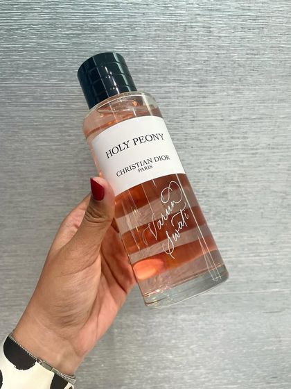A Holy Peony fragrance by Dior, engraved with two names. This is a popular choice for couples, anniversaries, and wedding gifts.