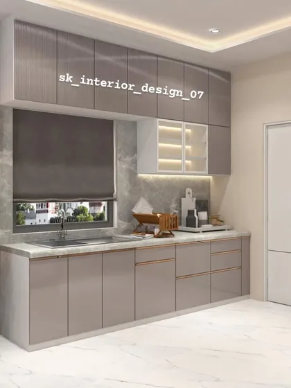 A straight-line kitchen with grey-toned cabinets and a marble-finish backsplash. The design is simple, elegant, and perfect for smaller apartments.