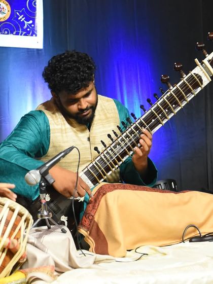 A clear shot of me performing with a tabla accompanist, showing the traditional setup for a Hindustani classical concert.