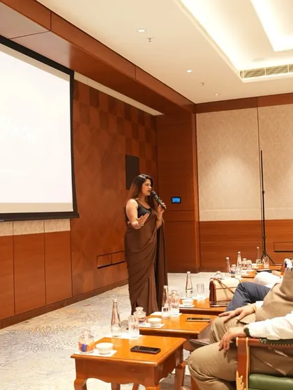 Presenting during a professional conclave. My hosting style adapts to the setting, whether it's a large auditorium or an intimate conference room.