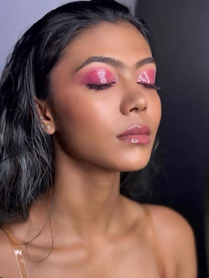 Another angle of the glossy pink editorial look. The effect is bold, modern, and perfect for making a statement in a fashion spread.