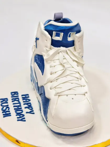 The front view of the Nike sneaker cake, showing the meticulously crafted laces and tongue. It's so realistic, you'll want to try it on!