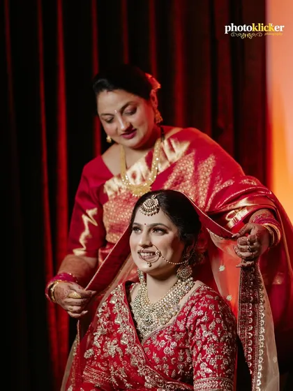 A tender, unscripted moment between a bride and her mother. Capturing these genuine family emotions is at the heart of what we do, preserving the small, meaningful interactions that make a wedding day so special.