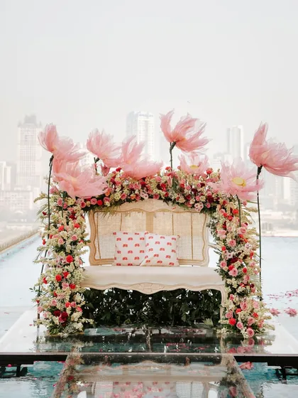 The bridal seating, seemingly floating on water, with the Mumbai skyline in the background. A truly magical setting for a mehendi.