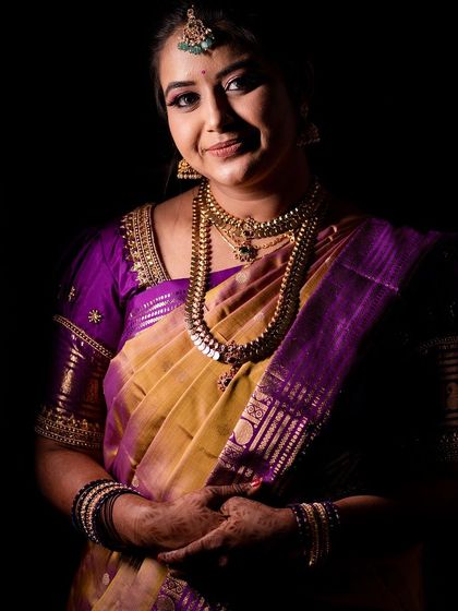 Varshini looking absolutely beautiful for her varpuje. This dramatic lighting highlights the flawless finish of her airbrushed makeup.