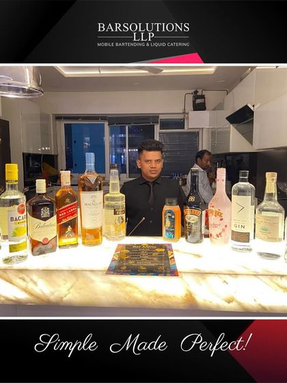 An illuminated marble-top bar for a modern house party, staffed by our professional bartender.