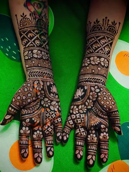 A traditional design featuring lotus and elephant motifs, classic symbols in Indian mehandi art.