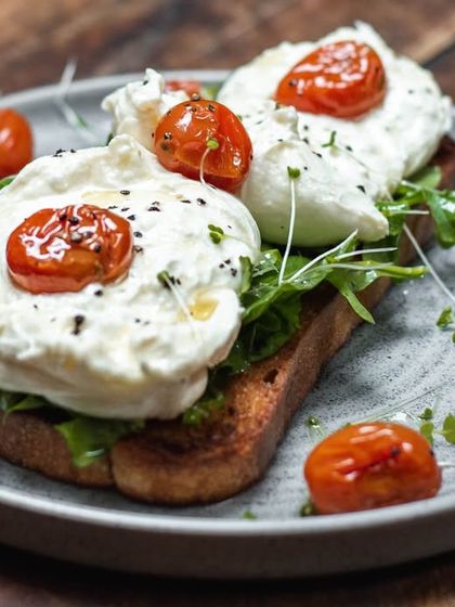 Our Burrata and Confit Tomato Toast, a simple yet elegant breakfast option available at select locations.