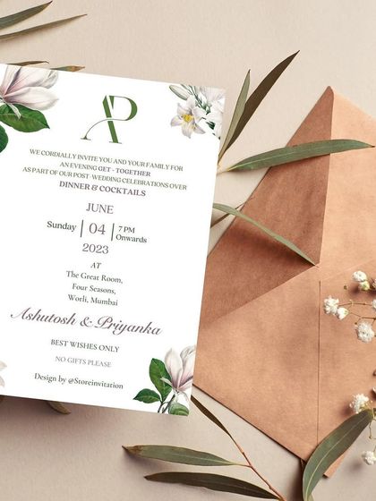 A post-wedding invitation that is the epitome of modern elegance. The design uses a clean, minimalist layout with beautiful white lilies and greenery, perfect for a sophisticated dinner and cocktail reception.