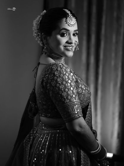 A simple yet stunning black and white portrait of the bride. Her happy, confident smile is the main focus of this timeless shot.
