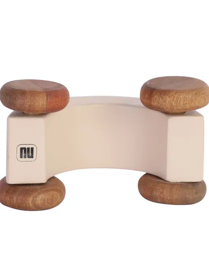 The bottom of a white wooden toy car, showing the brand mark.