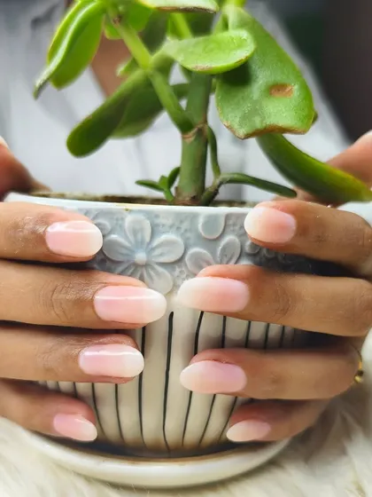 Another view of the natural-looking Gel-X extensions, showing their smooth finish and elegant oval shape.